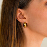 A woman wearing the Amaya Earrings while looking side on