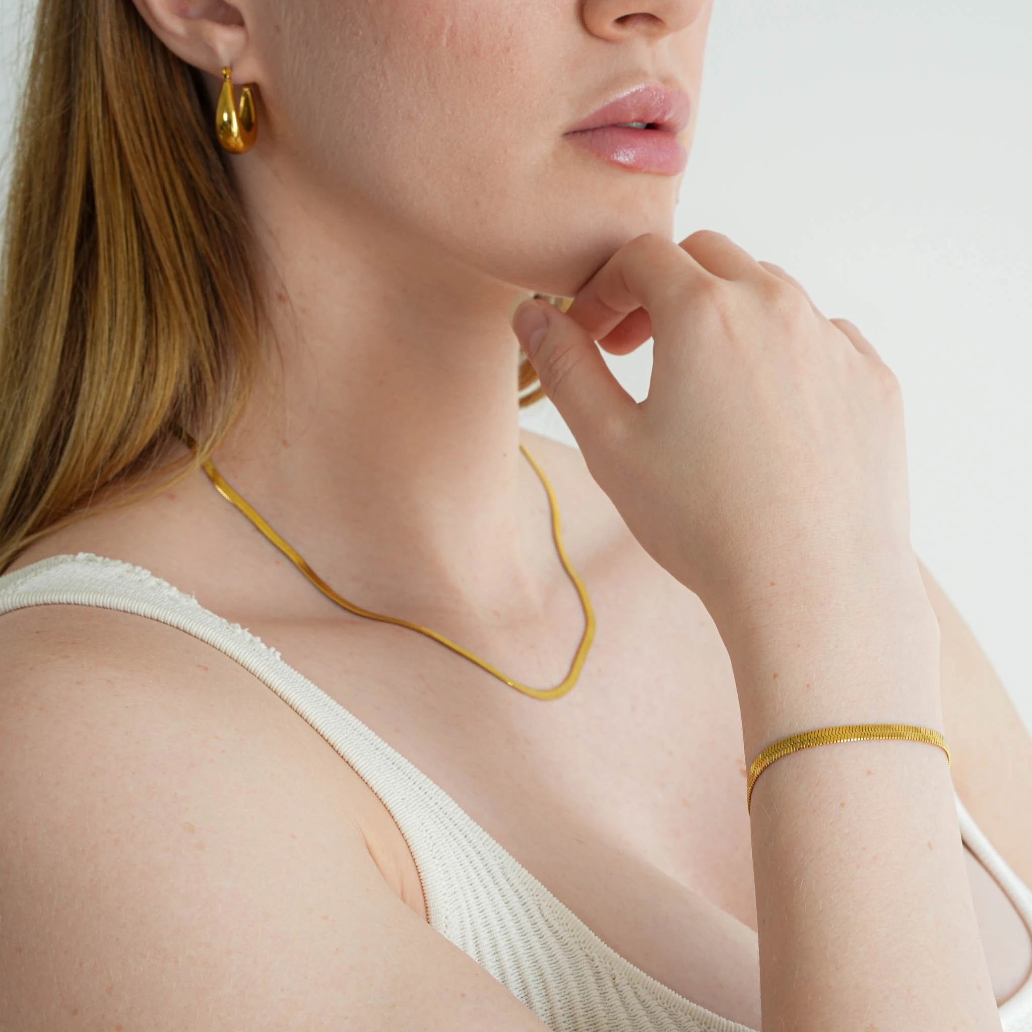 A woman wearing the 18K gold plated Kaia Bracelet